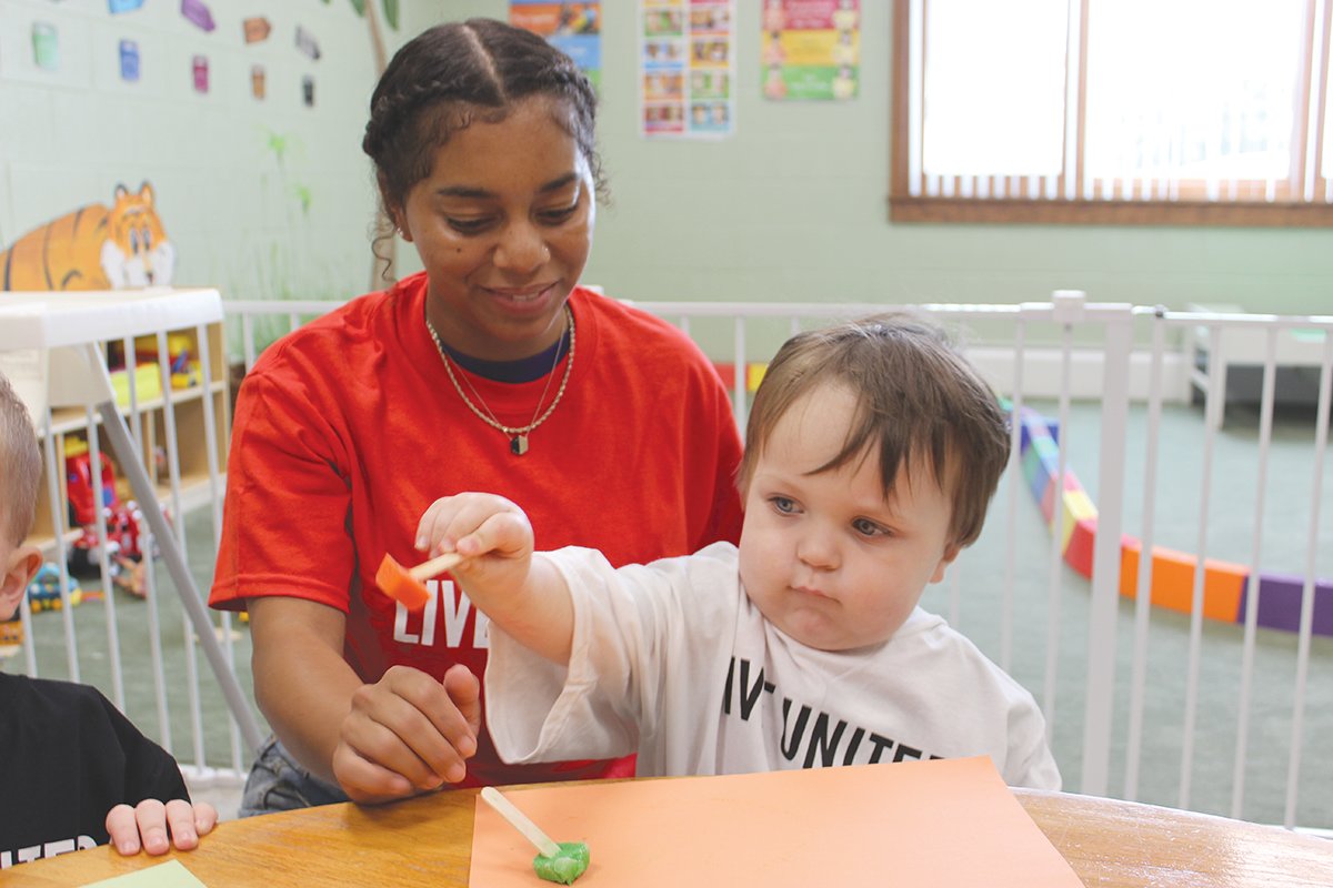 Rebekah Lee uses art play to work on motor skills with a young student at Hand in Hand Creative Learning, one of 15 United Way in Montgomery County partner agencies.